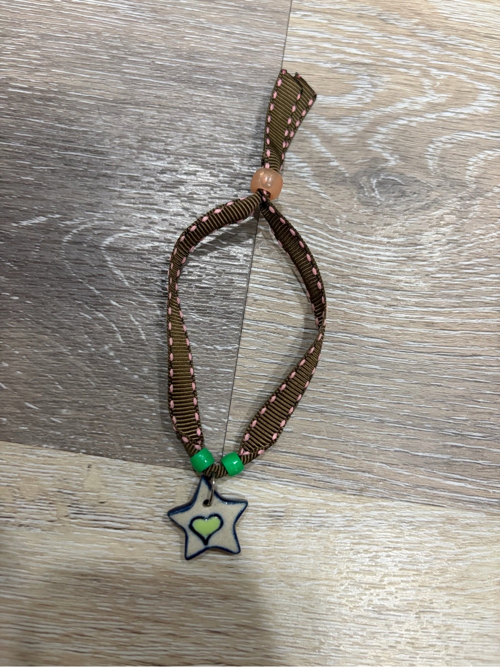 Brown & Pink Ribbon Star Bracelet with Green Accents